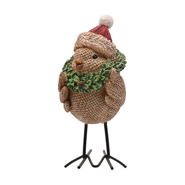 Christmas Robin resin figurine in brown with a hessian-textured body, red knitted bobble hat, and green holly wreath with red berries, standing on black wire feet against a white background.