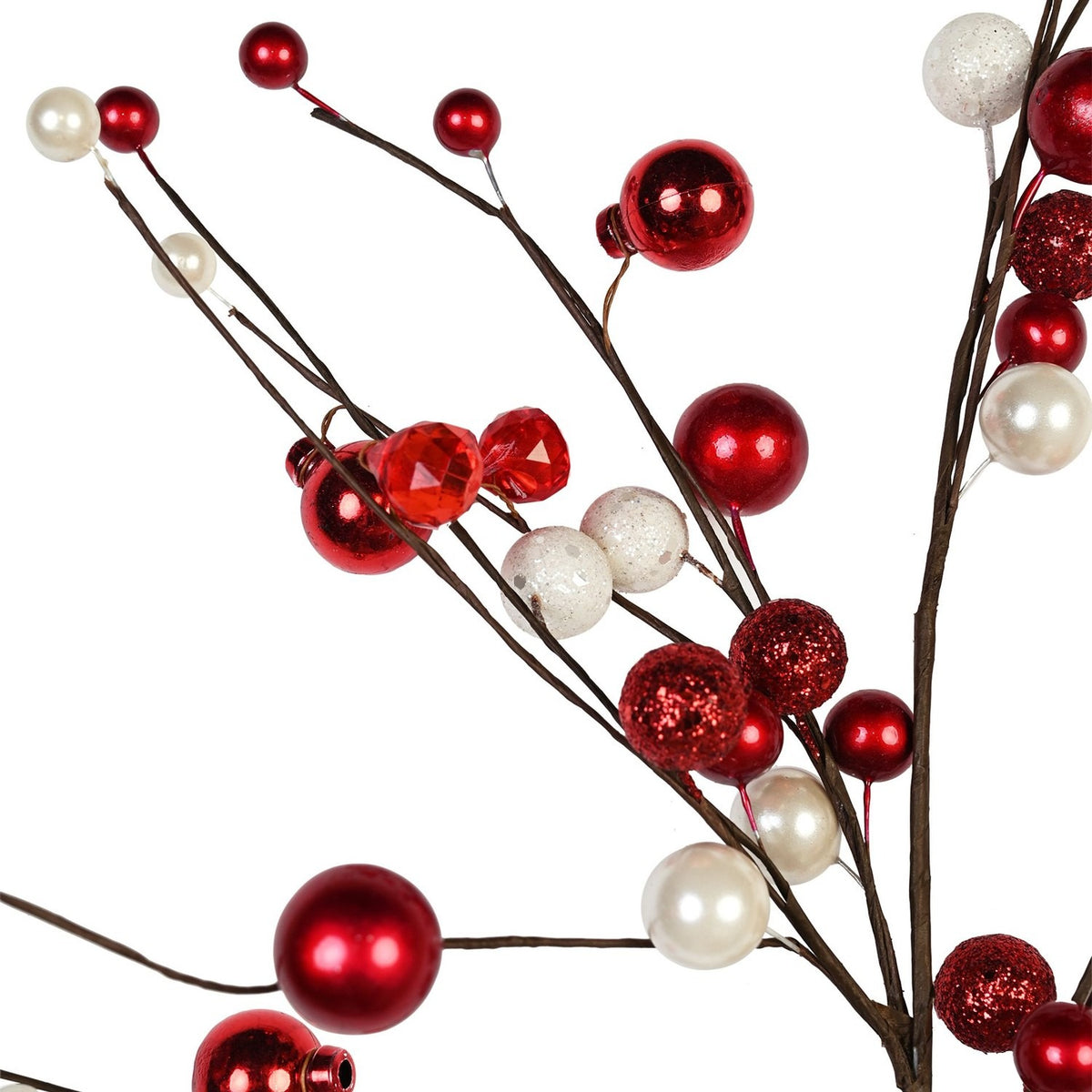 Close-up of a Christmas decorative stick with branching twigs topped with red glossy, pearly, and glittered baubles, faceted beads, and white pearl accents, set against a plain white background.