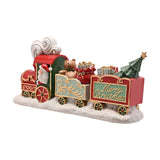 Red Santa & Friends train decoration with Santa in a green engine, a teddy bear and gift sack in a mint carriage, and a glittered tree in the rear car, on a white snowy base.