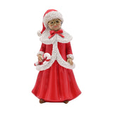 Resin Mrs Claus Christmas figurine in a red coat with white fur-trimmed collar and hem, red hat, gold-rimmed glasses, holding a candy cane, on a plain white background.