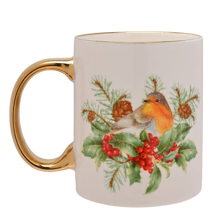 White ceramic mug with electroplated gold handle and rim, featuring a robin on holly with berries, pine cones, and fir branches, shown on a plain background.
