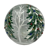 Christmas Tree Glass Light-Up Decoration, 12cm round crackle glass globe with snow-laden green trees, coloured baubles and a bare white tree, on a plain background.