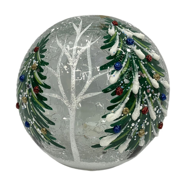 Christmas Tree Glass Light-Up Decoration, 12cm round crackle glass globe with snow-laden green trees, coloured baubles and a bare white tree, on a plain background.
