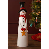 Tall white resin snowman garden ornament, 72cm, with black top hat, red striped scarf, red mittens holding a golden star, and black buttons, displayed beside a Christmas tree.