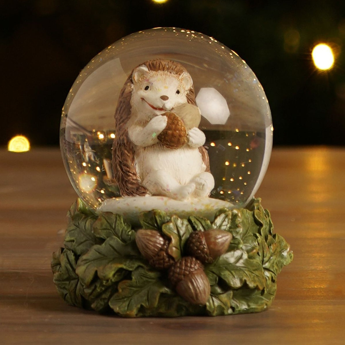 Resin Hedgehog Snow Globe with Natural Leaf Base - Green & Clear