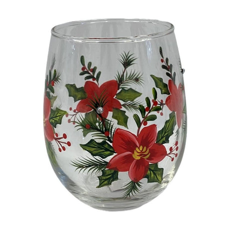 Stemless wine glass with hand-painted poinsettia design featuring red flowers, yellow centres, holly leaves, pine sprigs and berries on clear glass.