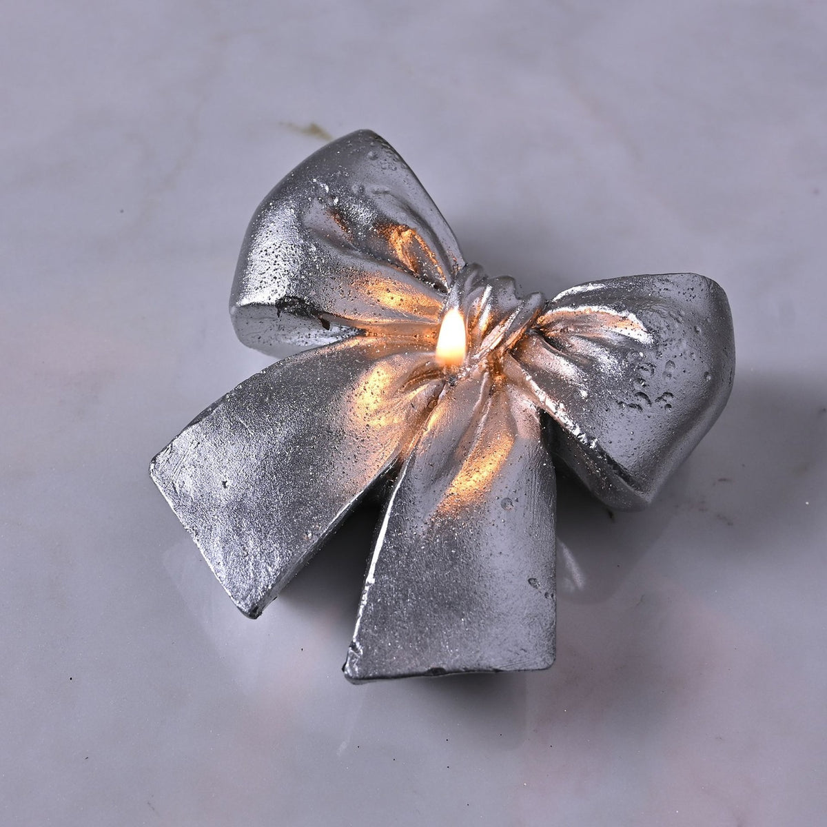 Metallic Knotted Bow Candle with Centre Wick 10cm - Silver