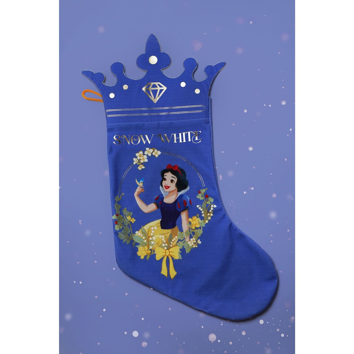 Blue Snow White Christmas stocking with crown-shaped top, gold "SNOW WHITE" lettering, and a printed portrait of the princess with a bluebird, framed by cream and yellow flowers.