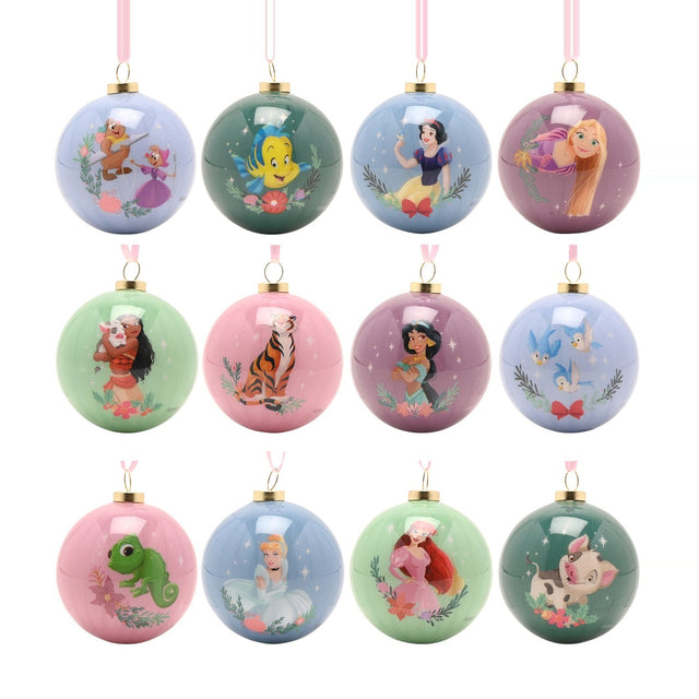 Set of 12 glossy 6cm round baubles in muted pastels, featuring Disney princesses and sidekicks like Moana, Ariel, Rapunzel, and Jasmine framed by leaves and stars.