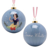 Round glossy blue bauble from the Princess & Sidekick set, one side printed with Snow White and a bluebird framed by foliage, the other reading "Snow White", pink ribbon hanger, on a white background.