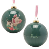 Round glossy green bauble from the Princess & Sidekick set showing Pua the pig with holly and berries, paired with a plain reverse reading "Pua" on a white background.