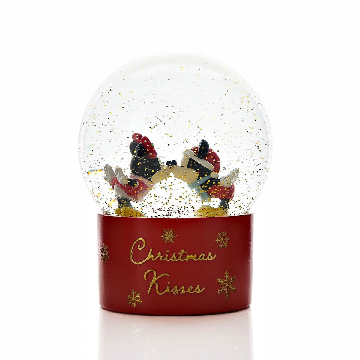 Mickey Mouse & Minnie Mouse Christmas Kisses Snow Globe with gold glitter inside a round dome, set on a red base reading "Christmas Kisses", shown on a plain white background.