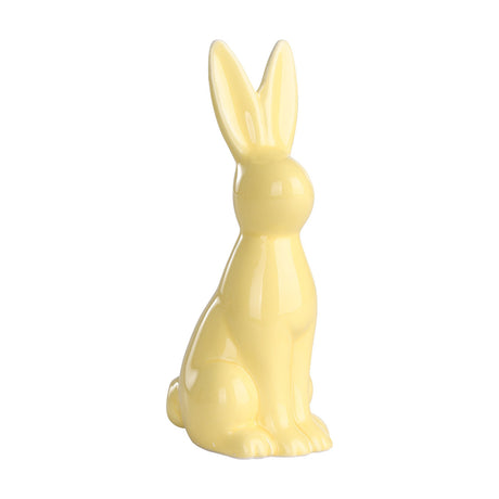 Yaypan ceramic rabbit ornament in pastel yellow with a glossy glaze, sitting upright with tall ears and smooth, rounded features, set against a plain white background.