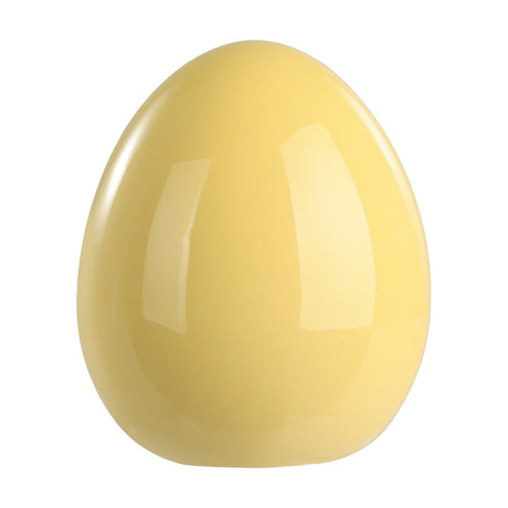 Yaypan Decorative Egg in pastel yellow, a smooth glossy ceramic ornament with a classic egg shape and flattened base, shown on a plain white background.