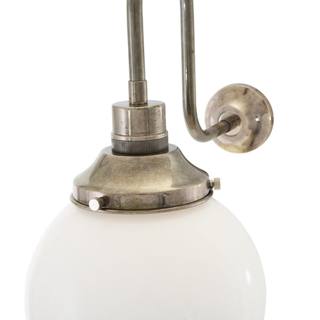 Yerevan Glass Swan Neck Globe Wall Light in brass finish, close-up of the curved arm, round wall plate and opal glass globe against a plain white background.