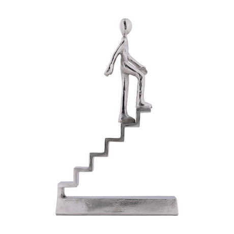 Zadiwin 39cm aluminium figurine sculpture in silver, a stylised figure climbing a textured staircase on a flat rectangular base, shown against a plain white background.