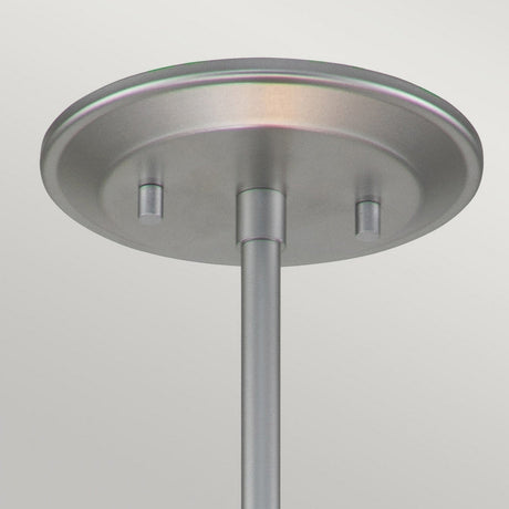 Close-up of the ceiling canopy from the Ziggy 1 Light Duo-Mount Small Pendant/Semi-Flush in Lacquered Silver, featuring a brushed metal finish. The circular canopy has two small protrusions flanking the rod, evoking modern lighting design, set against a light-colored background.