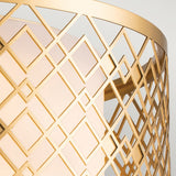 A close-up showcases the geometric lattice pattern in lacquered gold, with interlocking diamonds and squares. Set against a soft, light background, it embodies a contemporary style similar to the Ziggy 2 Light Medium Flush - Lacquered Gold.